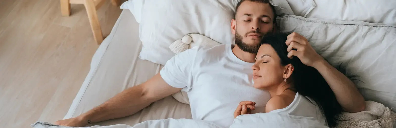 couple sleeping peacefully in bed bug free bed