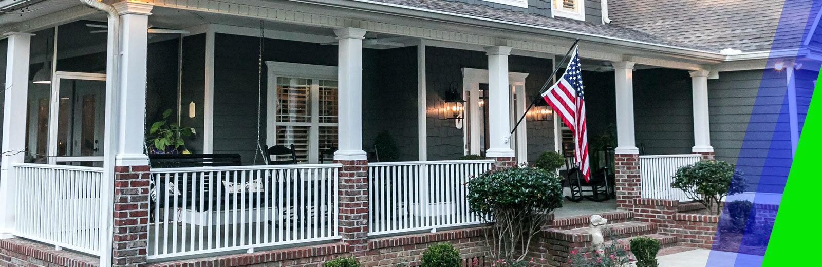 blue home front porch with an American flag